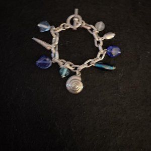 SILVER TONE SEA SHELL AND RHINESTONE CHARM BRACELET